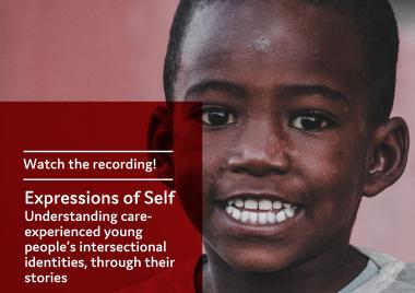 young black boy smiling and showing his teeth