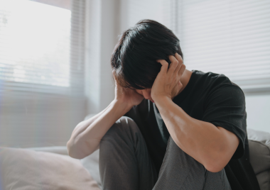 boy with his head in his hands
