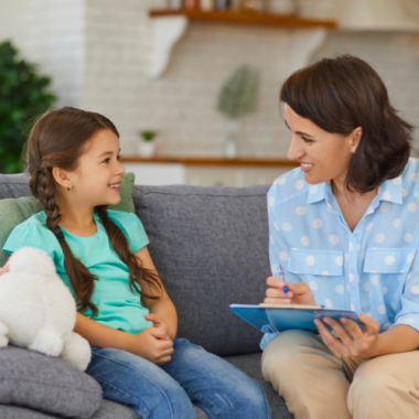 therapist and child on a sofa