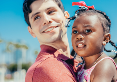 man carrying a child