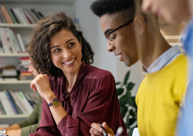 person smiling at colleagues