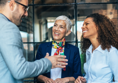 three professionals talking