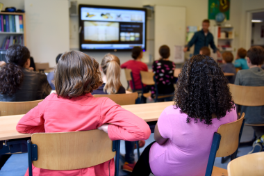 two children sitting at a school desk