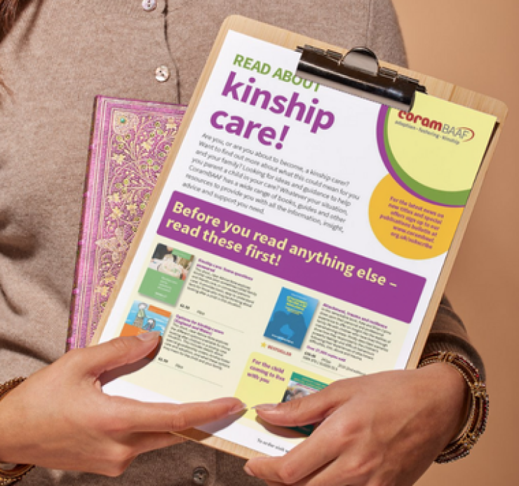 woman holding attached to clipboard